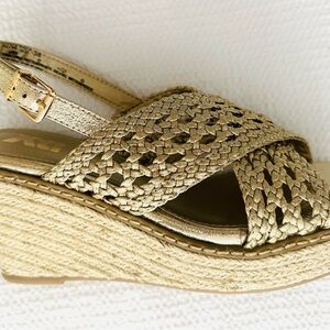 Soft gold woven leather espadrille wedge.  2.5-3” wedge height. Size 7.5M